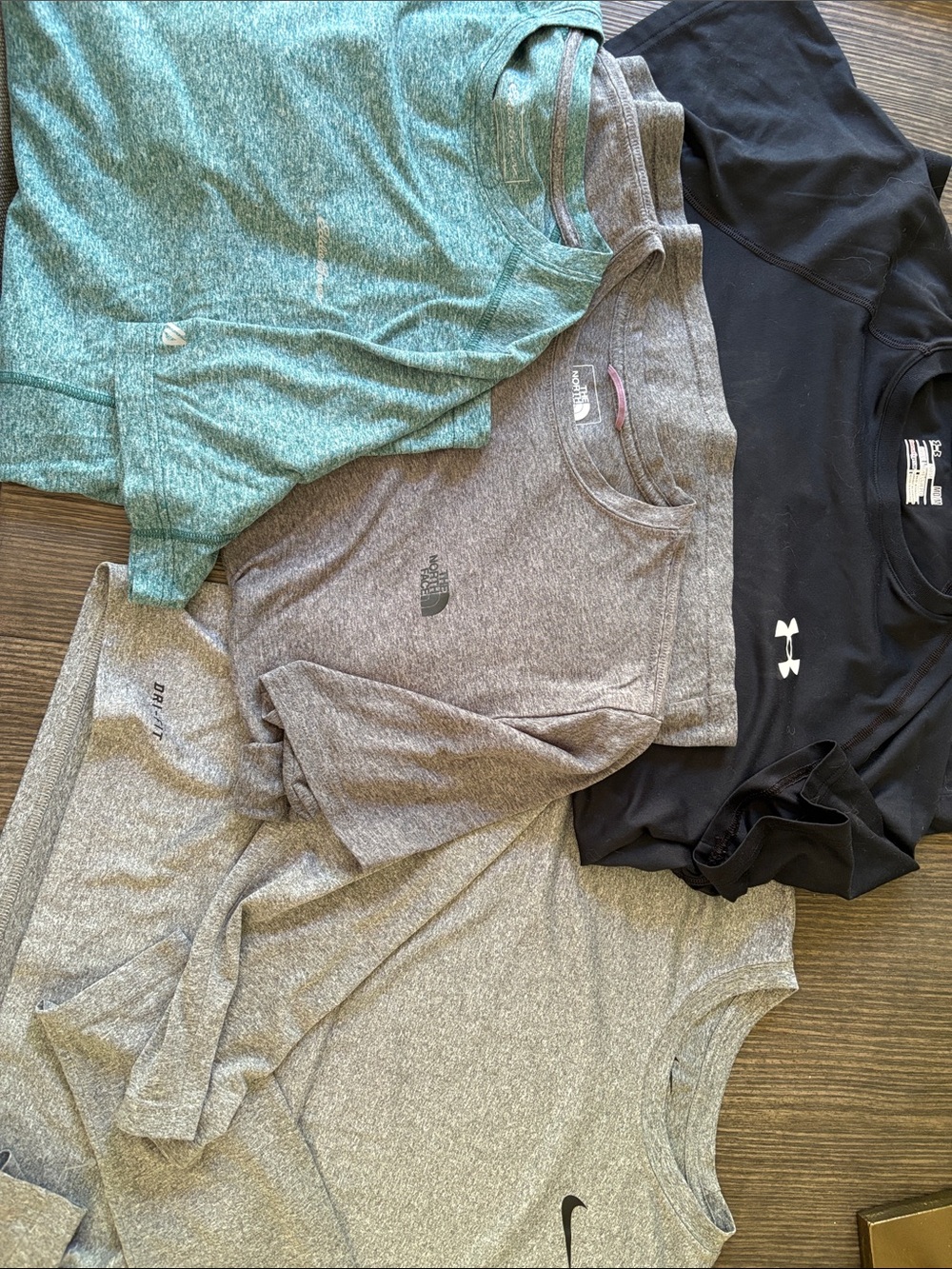 Four athletic tee shirts